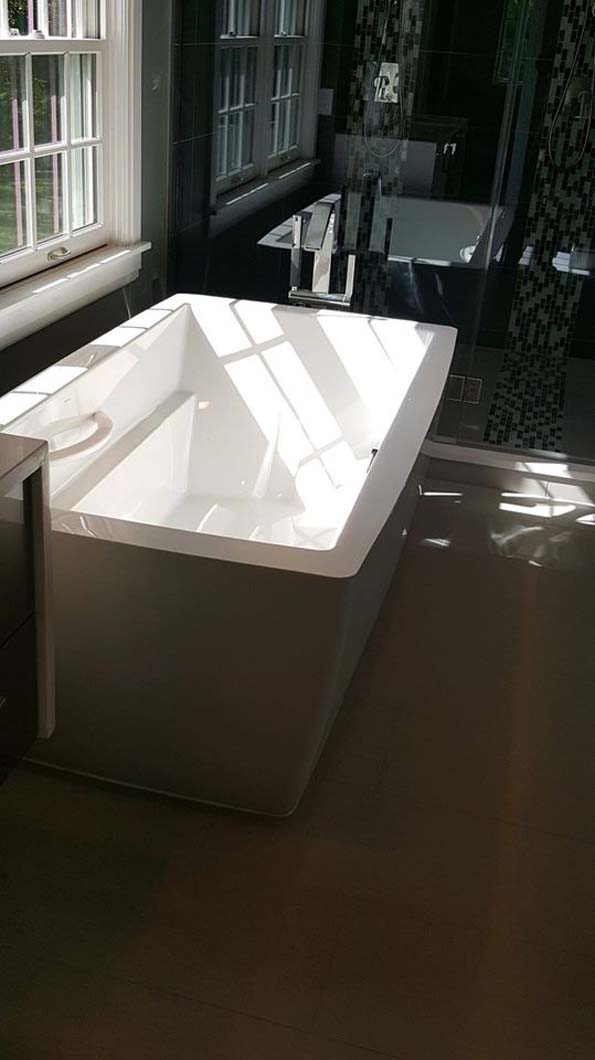 Free standing bath tub in bathroom bathroom designed by Weinstein Allentown Bath & Kitchen Design Services