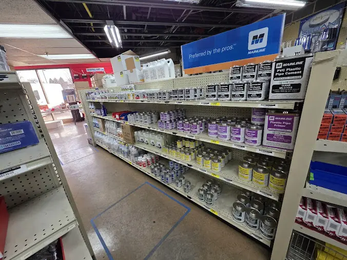 Weinstein PLumbing Supply Allentown shelves stocked with plumbnign sealants, primer, cleaner, cement and glue