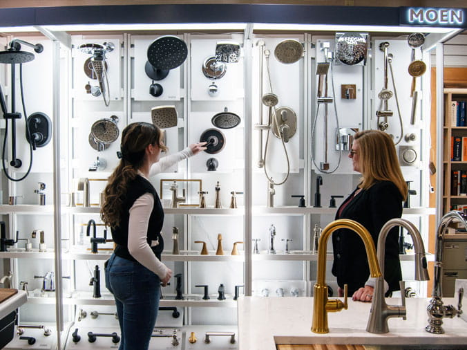 Client plumbing consultation at Weinstein Allentown Bath & Kitchen Showroom